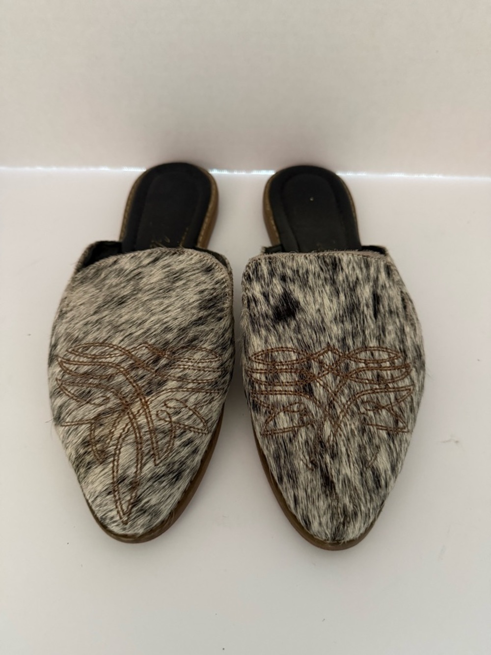 Cowhide Slip-On Mules in Black & White